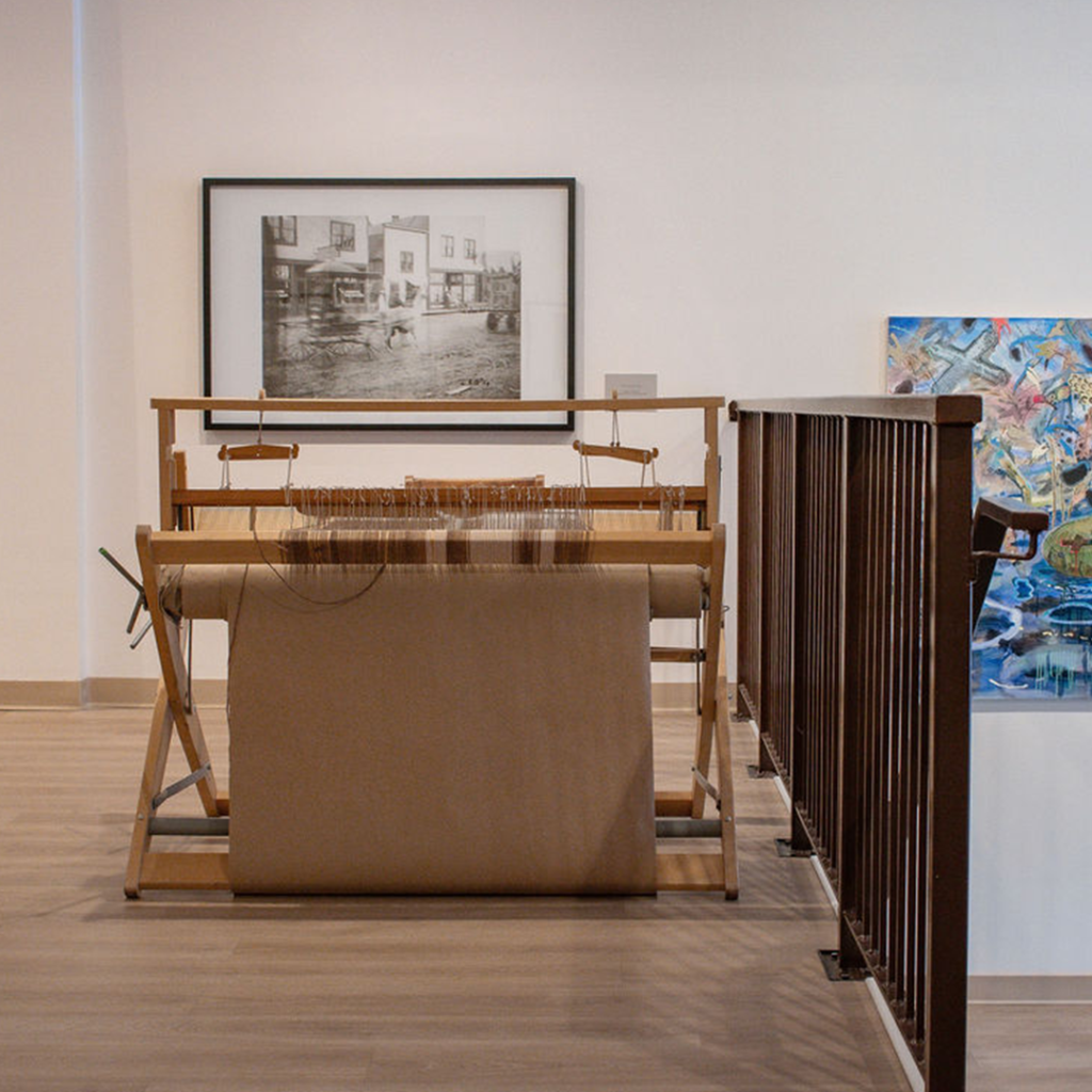 Step up to our donated loom, which allows KMA visitors to interlace their spun threads and create a collective fabric by hand.